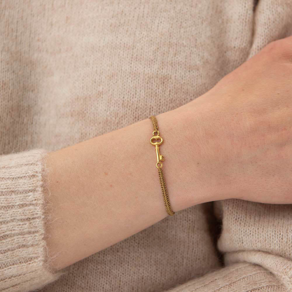 Symbol Key Gold Colored Bracelet